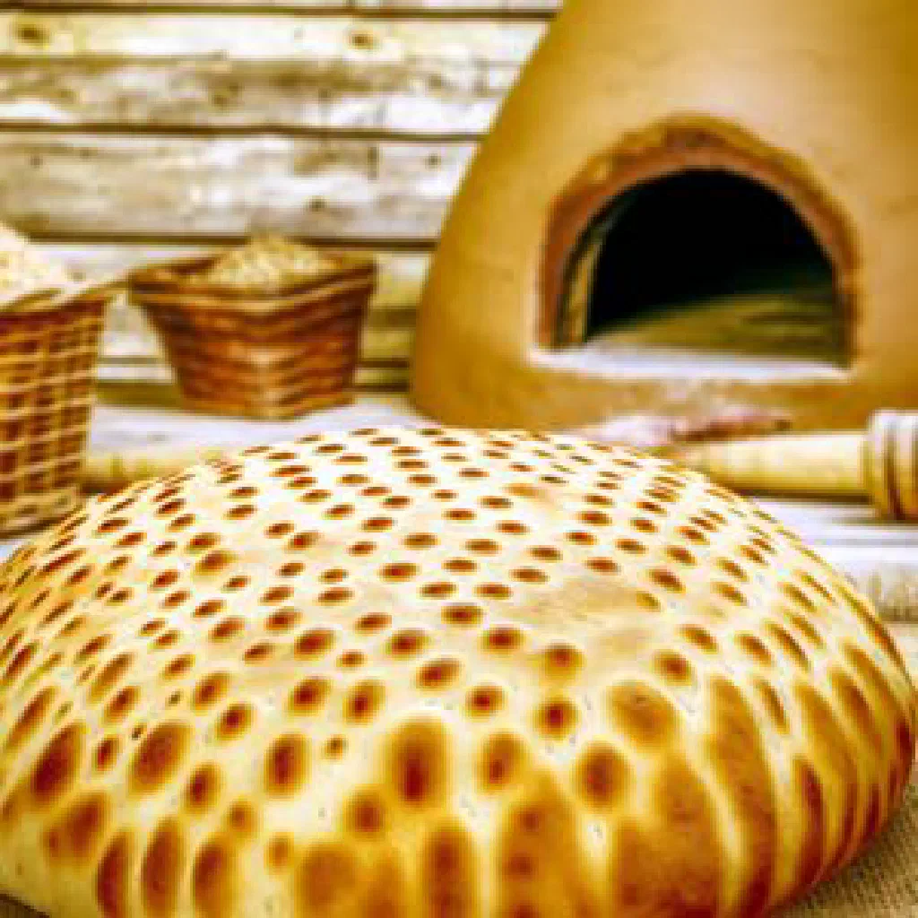 Round golden-brown patyr nan flatbread fresh from the oven