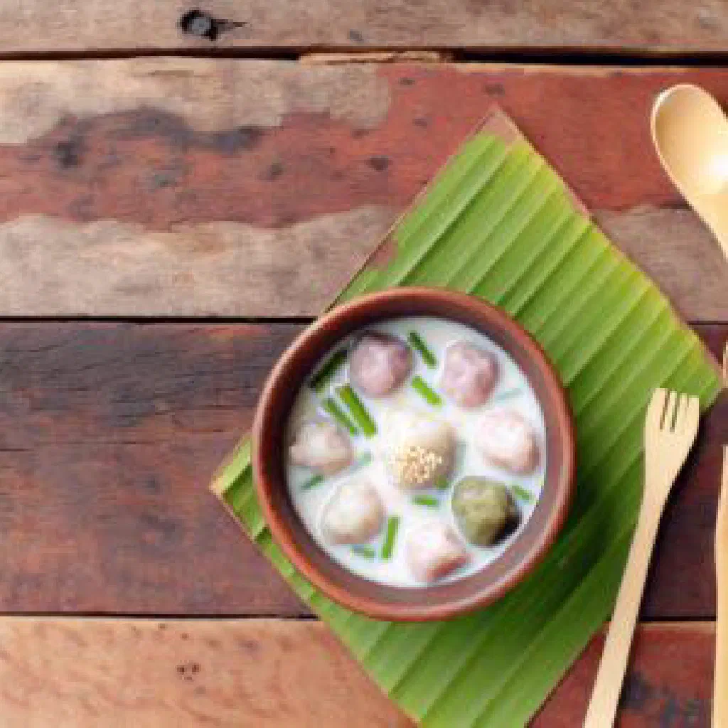 Colourful bua loy rice balls floating in sweet coconut milk