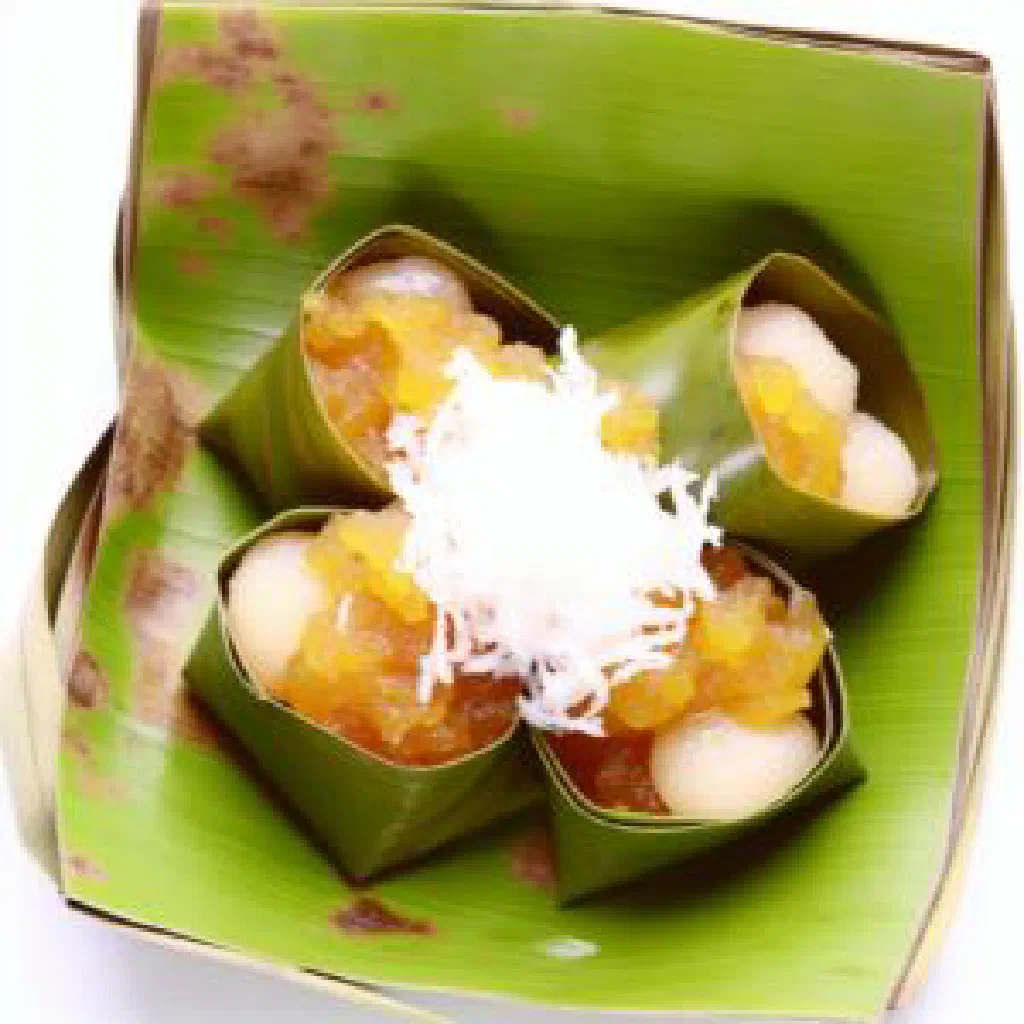 Small steamed Khanom Tarn coconut cakes on a plate