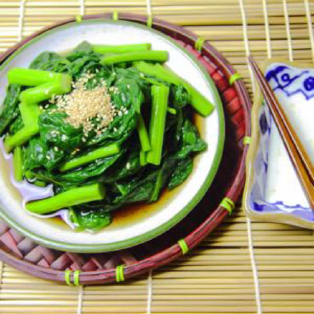 Stir-fried water spinach with garlic and soy sauce on a plate