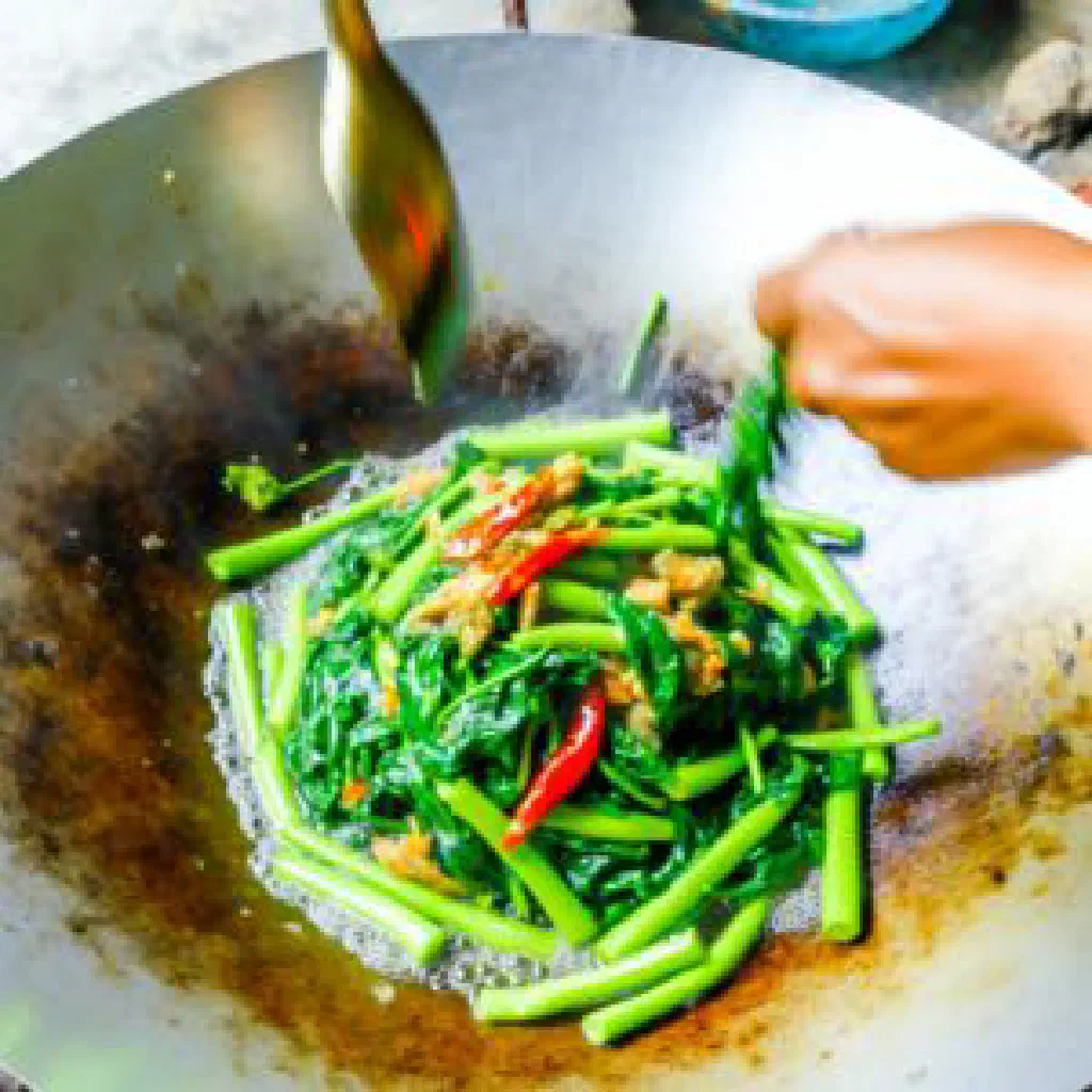 Stir-fried water spinach in oyster sauce with garlic and red chilli