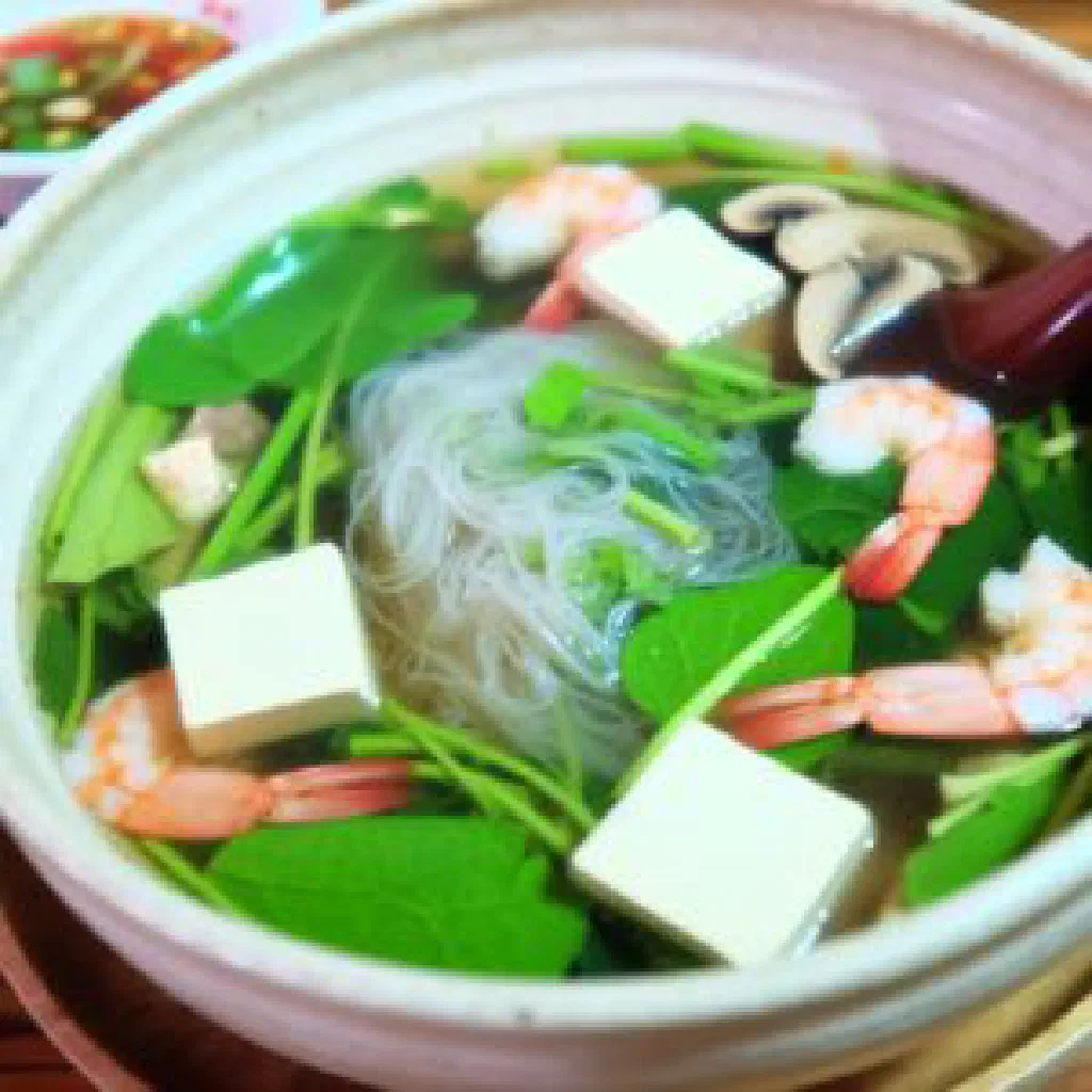 Thai suki nam hotpot with vegetables, rice noodles and dipping sauces