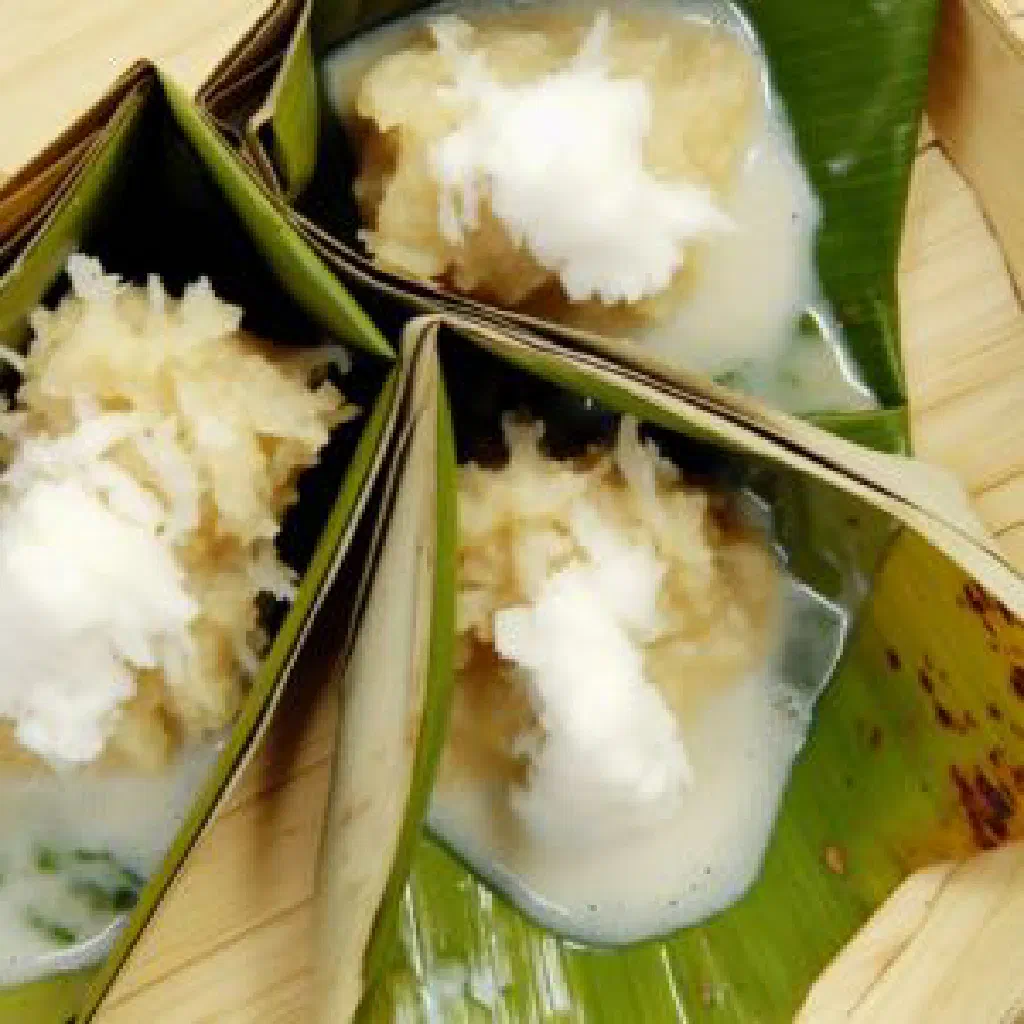 Sliced vakalolo, a Tongan coconut and rice dessert, on a plate