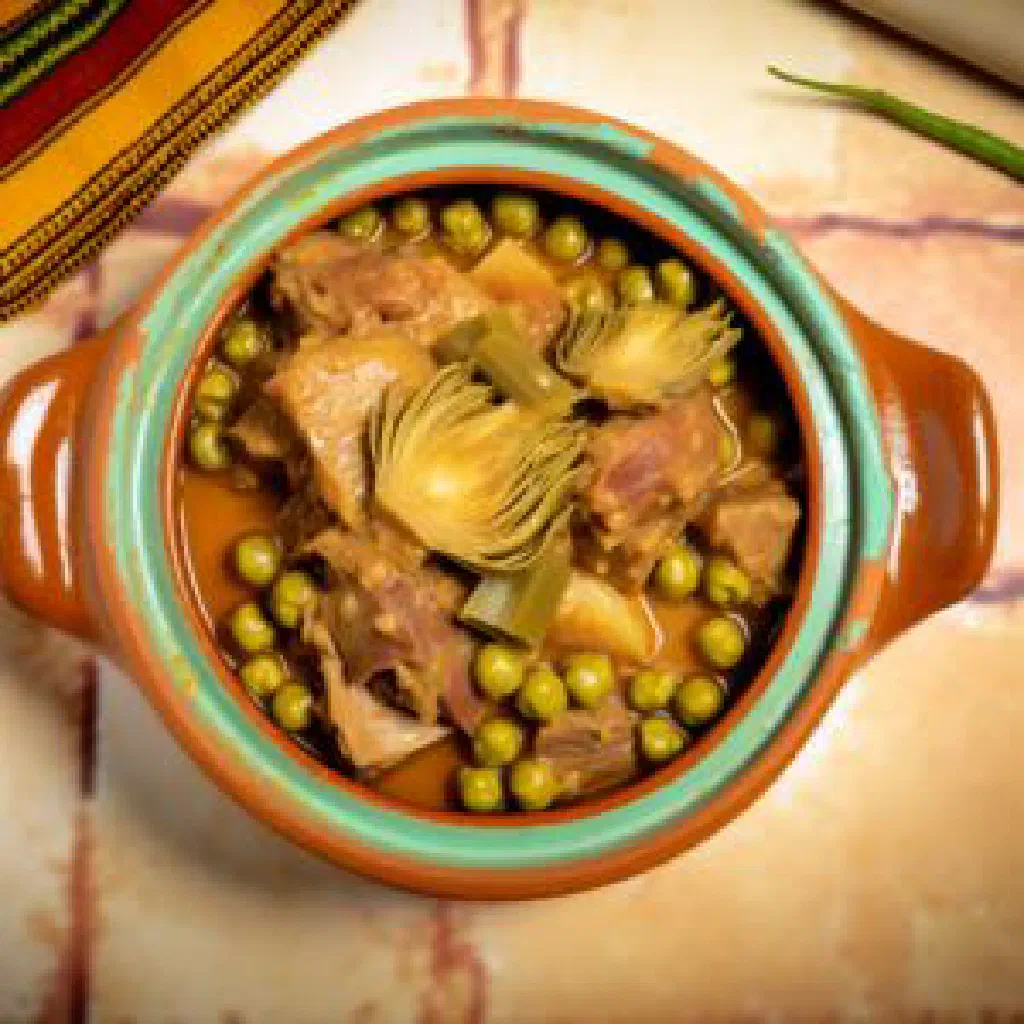 Tunisian marka hloua stew of tender meat in spiced tomato sauce with parsley