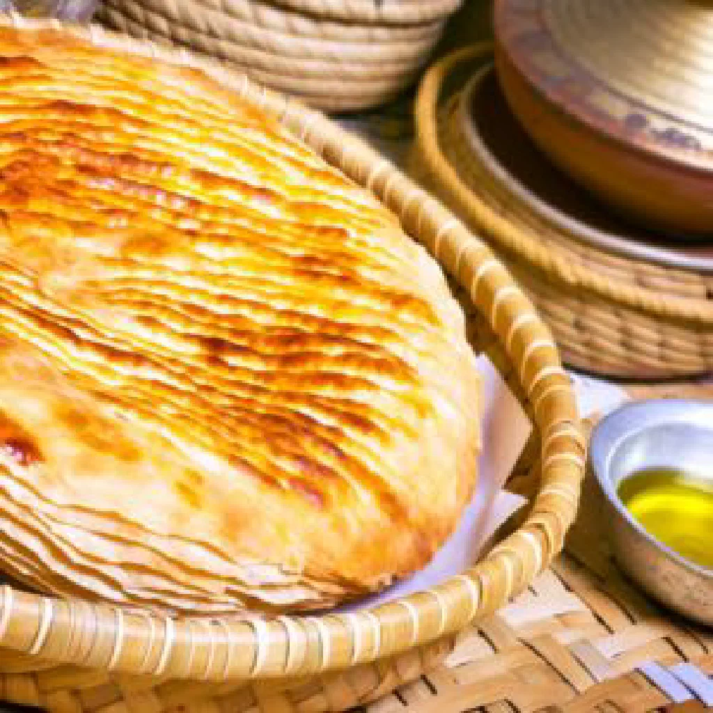 Golden pan-fried Mlawi flatbread served on a plate