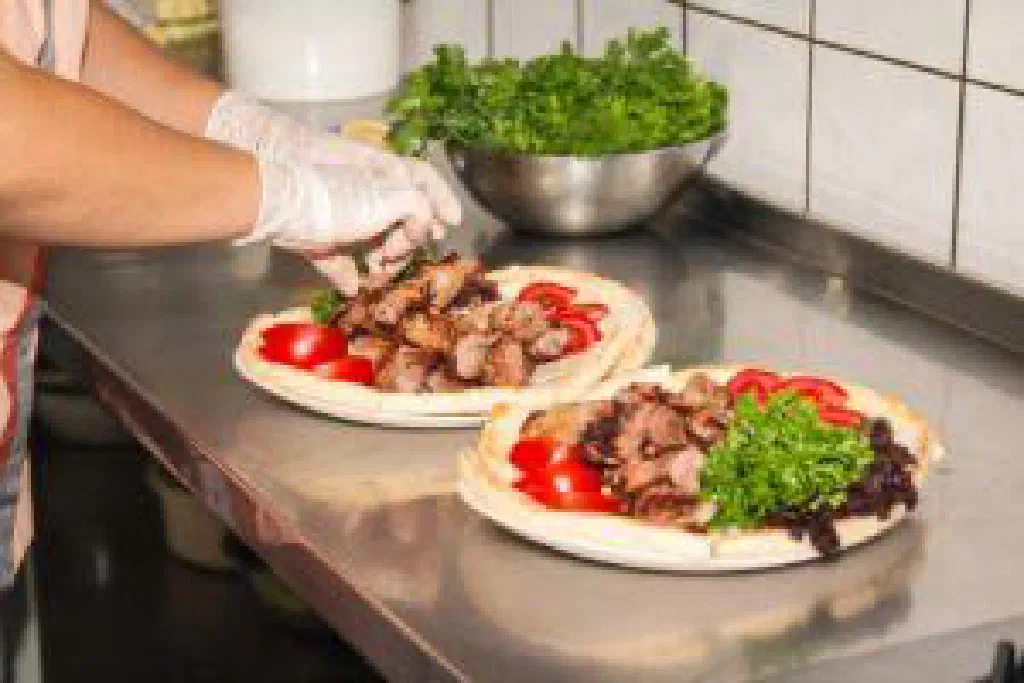 Spiced Turkish döner kebab with salad, tomatoes and onions