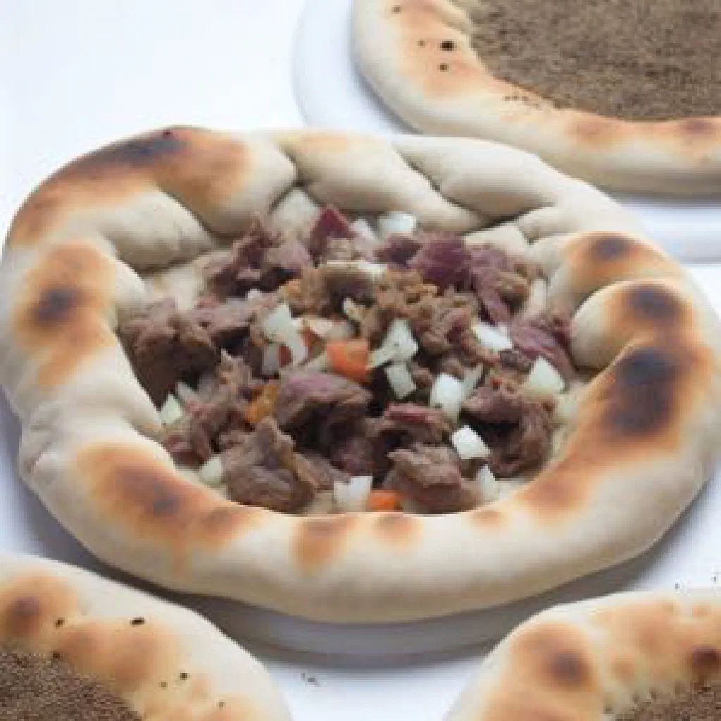 Golden Turkmen çal filled flatbreads garnished with fresh herbs
