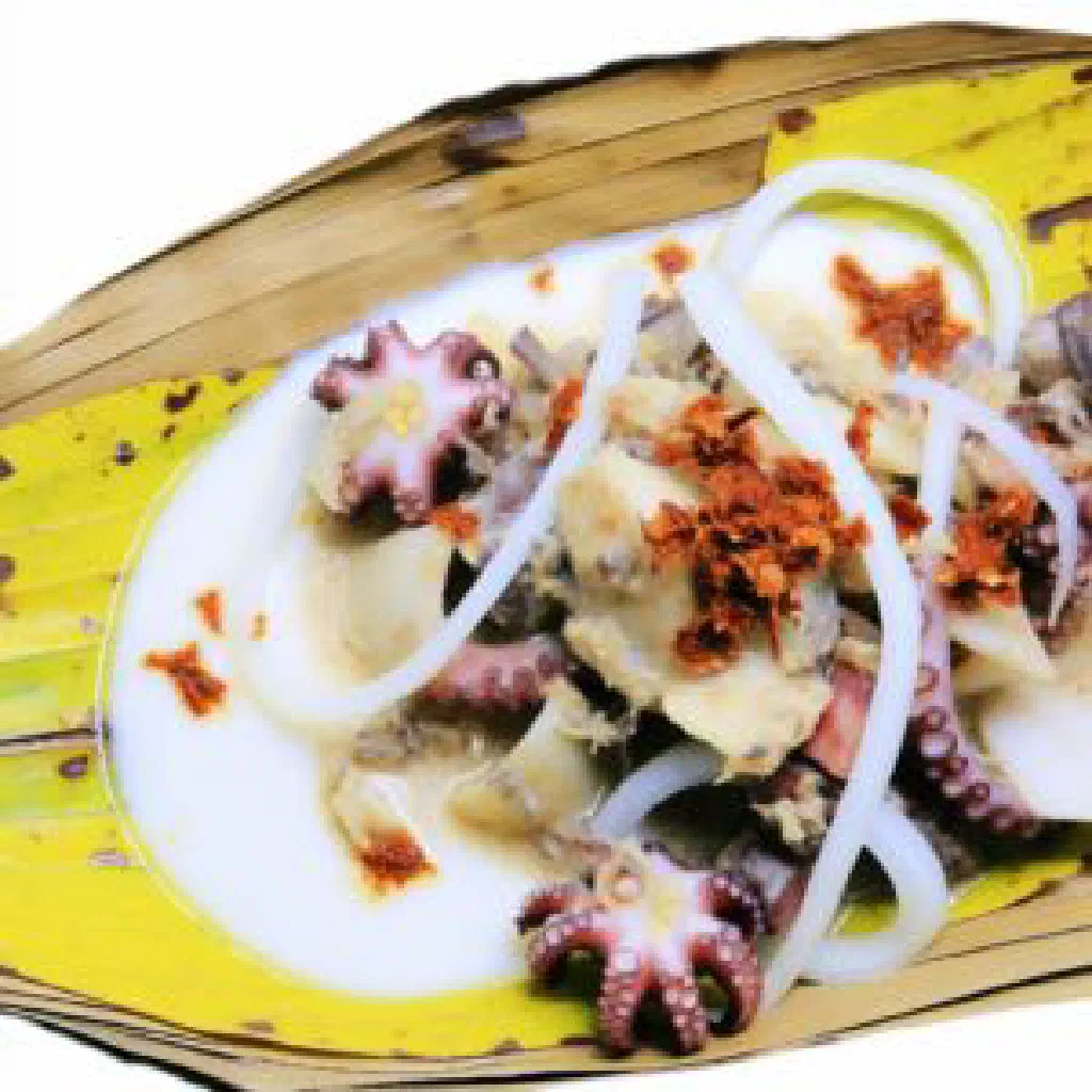 Tender octopus simmered in creamy coconut sauce, garnished with fresh coriander