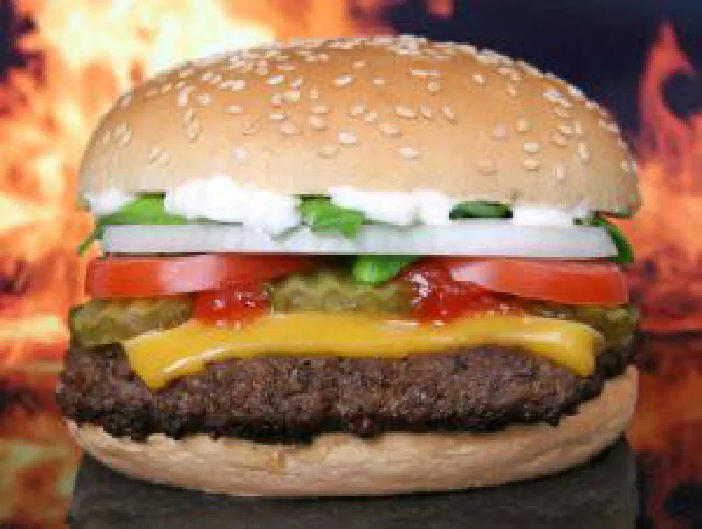 Classic American hamburger with melted cheese in a toasted bun