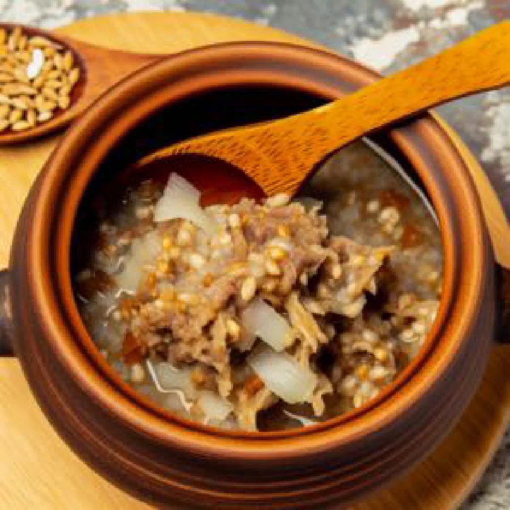 Khalisa with tender lamb, fragrant rice and fresh herbs in a serving bowl