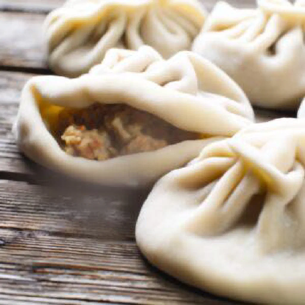 Golden baked Pahlavan pastry parcels filled with spiced minced meat