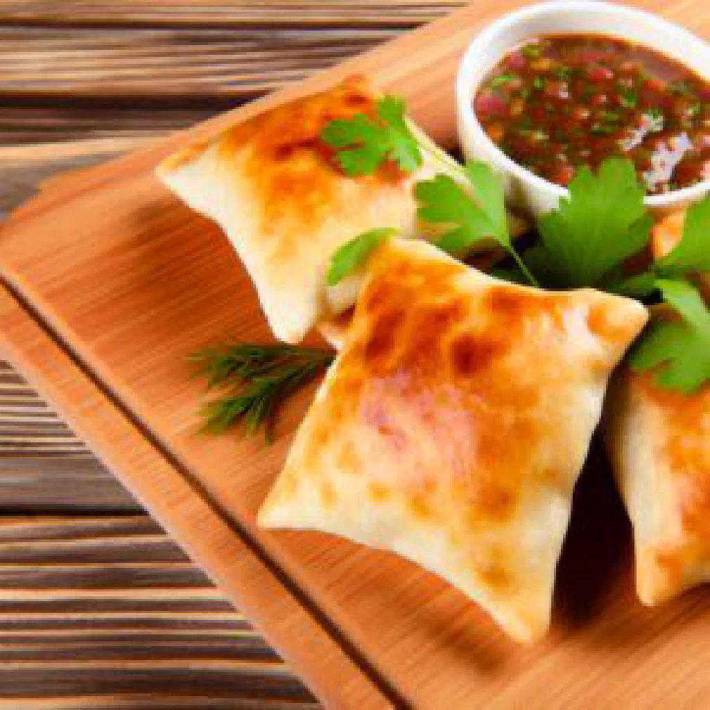 Golden baked Uzbek samsa pastries filled with spiced meat