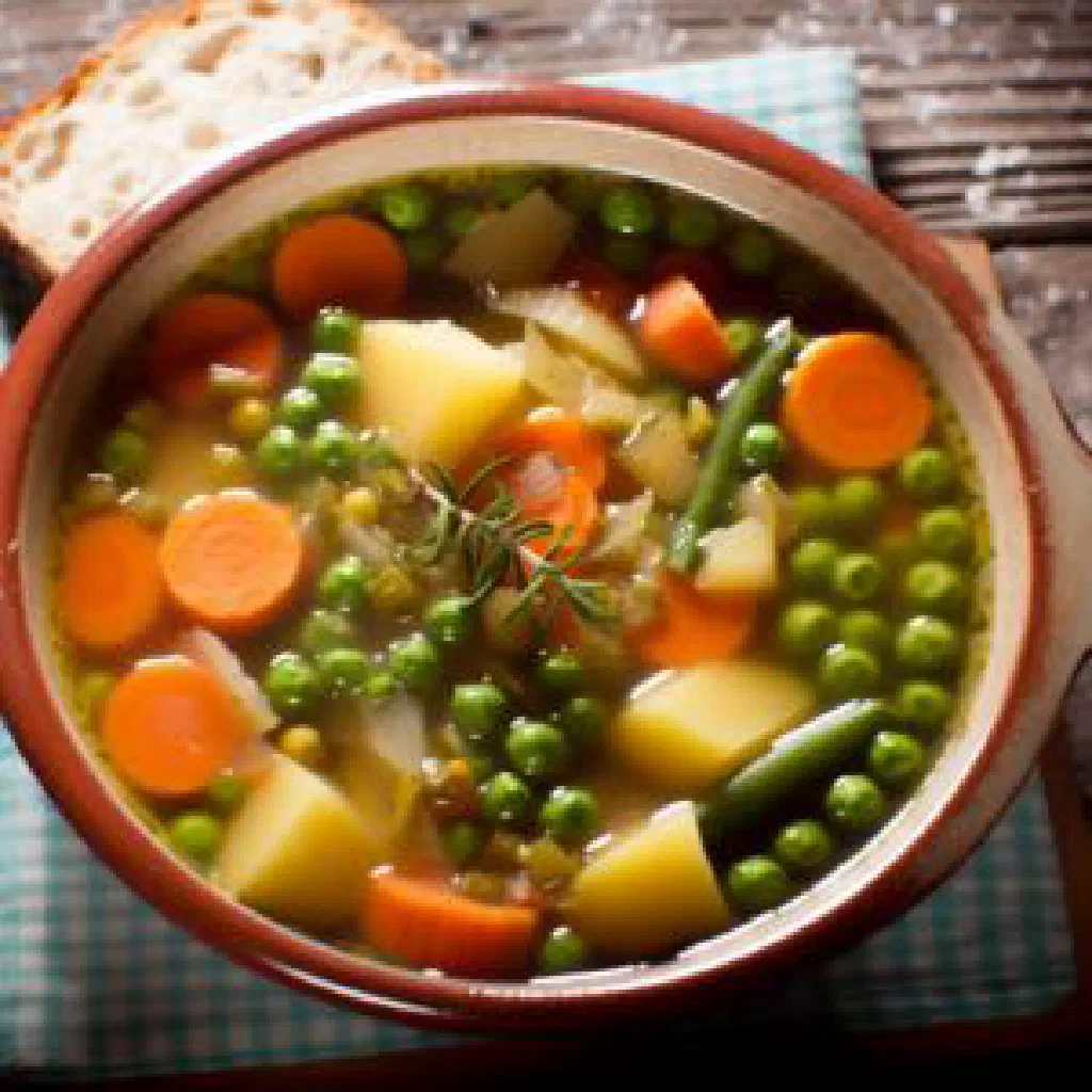 Bowl of muto wemichero, a thick maize meal stew with colourful vegetables